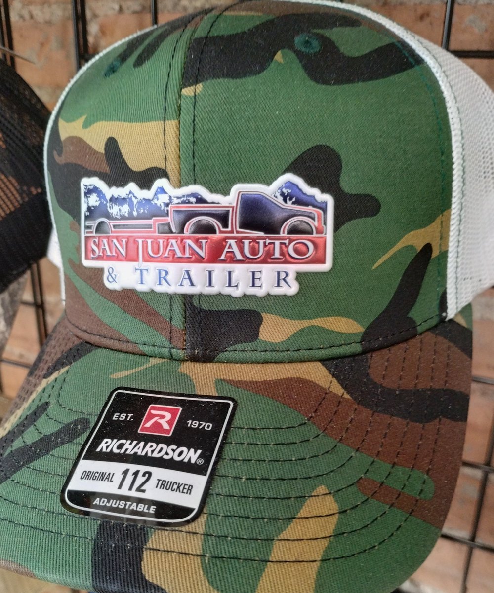 Custom camo trucker hat with San Juan Auto & Trailer patch — custom hat patches Colorado